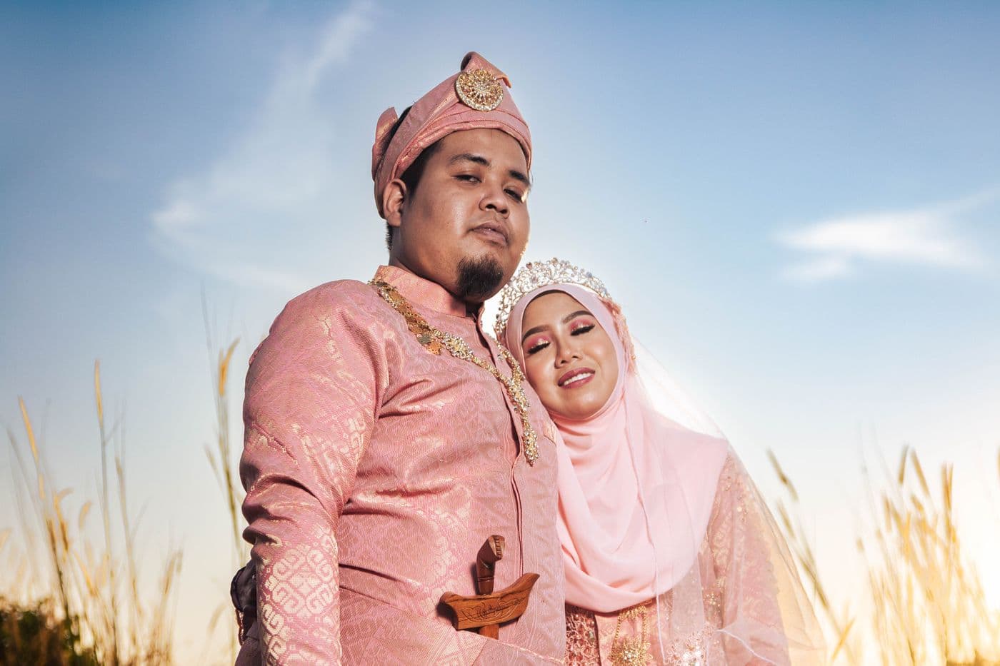 A Malaysian couple at their wedding, illustrating what instalment loans are used for
