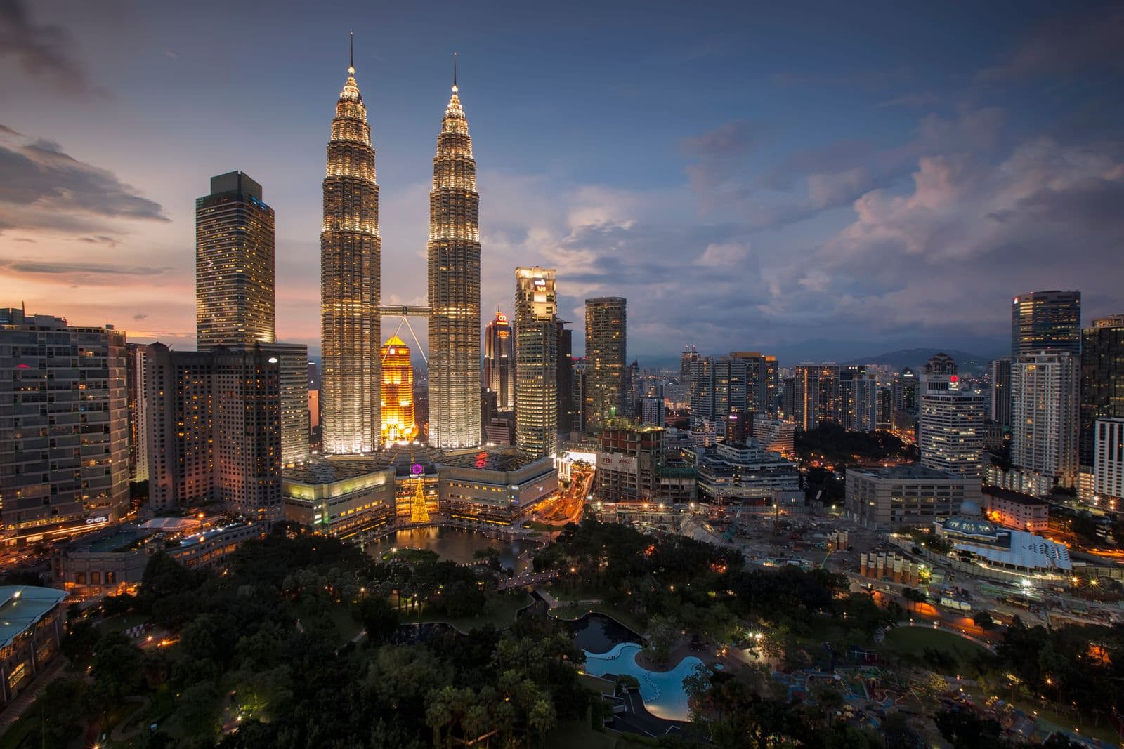 Kuala Lumpur skyline at dusk, illustrating a guide to Malaysian credit reports